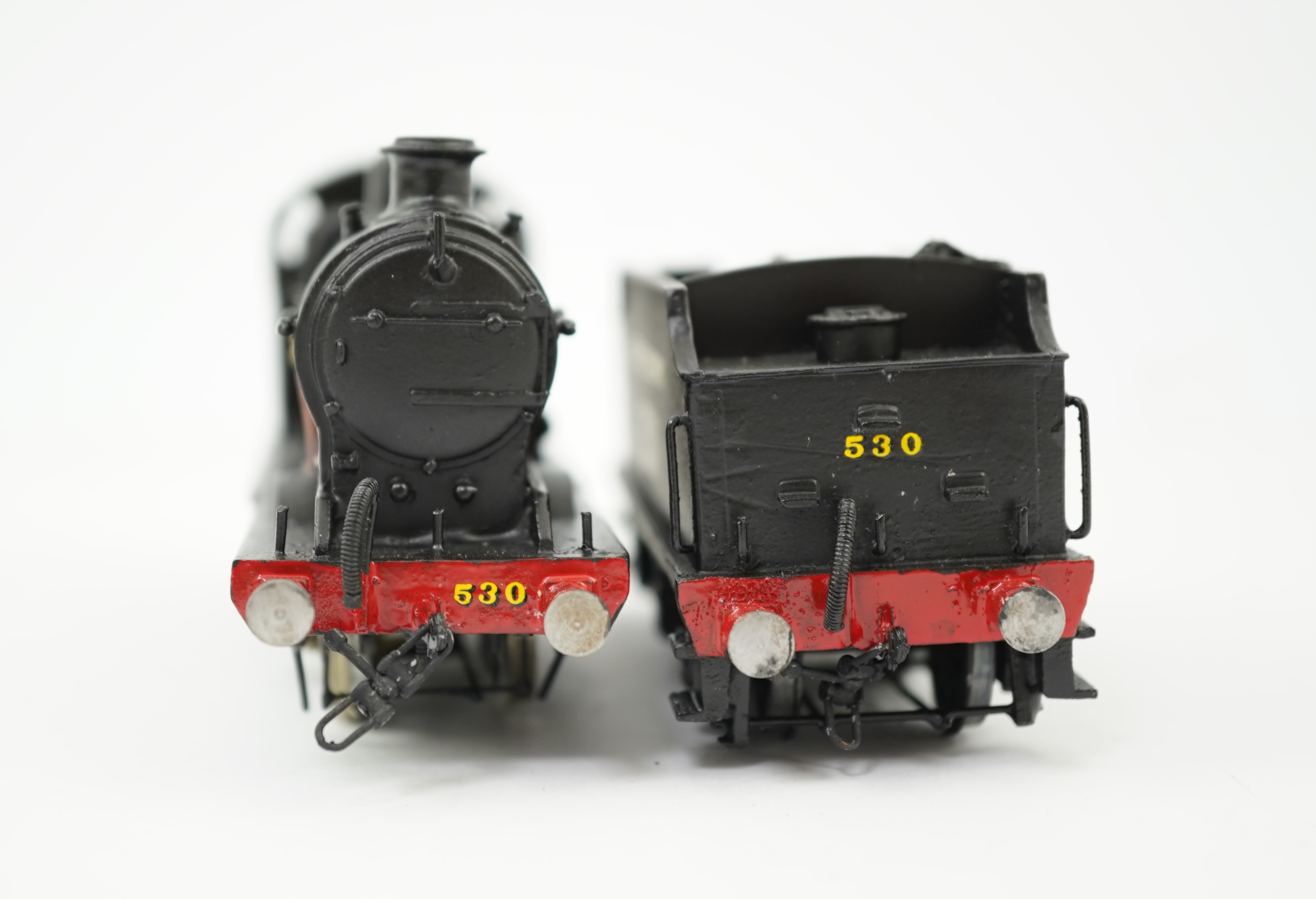 Two 00 gauge brass and white metal kit built Southern Railway tender locomotives; a Wainwright class L 4-4-0, 1769, together with an OO Works kit Maunsell class Q 0-6-0, 530, constructed, painted and lined to a high stan